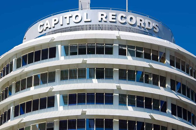 3-Hour Small Group Tour: Hollywood to Beverly Hills - Beverly Hills sign, the Pretty Woman hotel, and two iconic pink-and-green stays