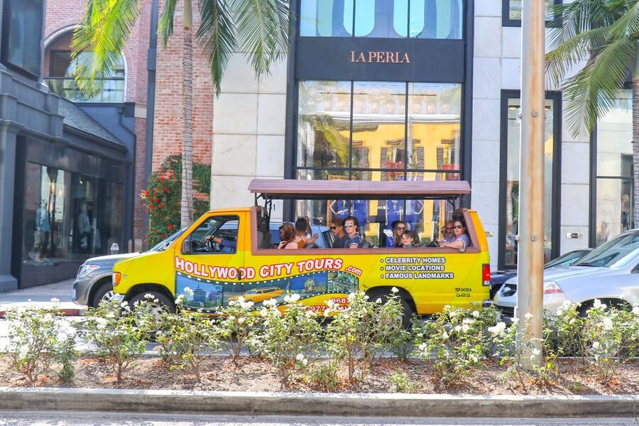 Los Angeles: Hollywood & Celebrity Homes Open-Air Bus Tour - Beverly Hills in perspective: sign, Rodeo Drive, and celebrity home roads